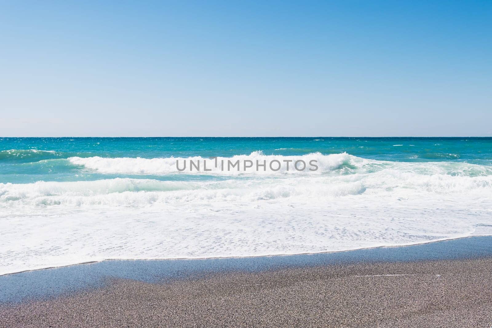 beautiful beach with sand, turquoise sea with waves. High quality photo
