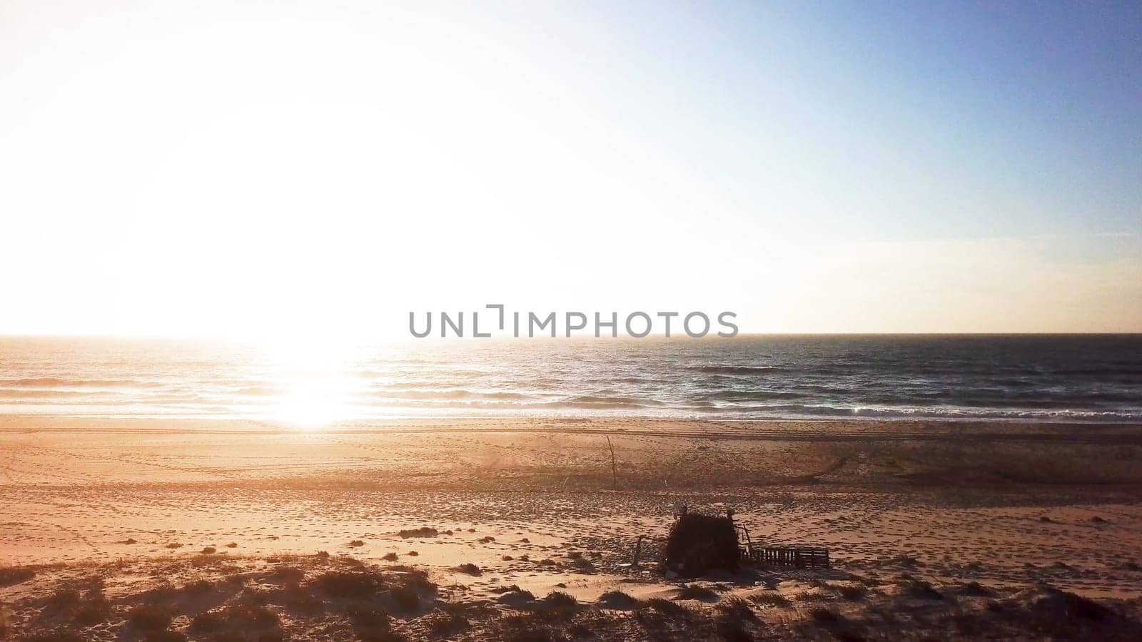 Aerial view of beach and sand dunes at sunset in Murtosa, Aveiro - Portugal. Aerial view.