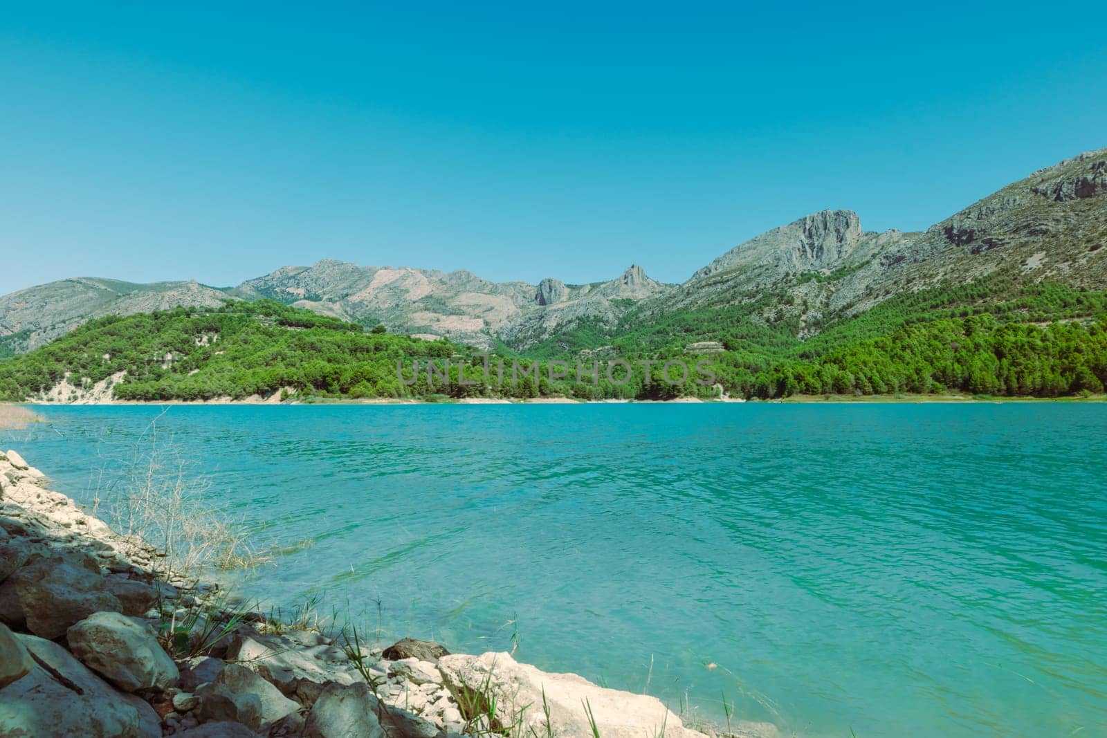 Mountain landscape, picturesque mountain lake on a summer morning, large panorama, Spain, Guadalest. High quality photo