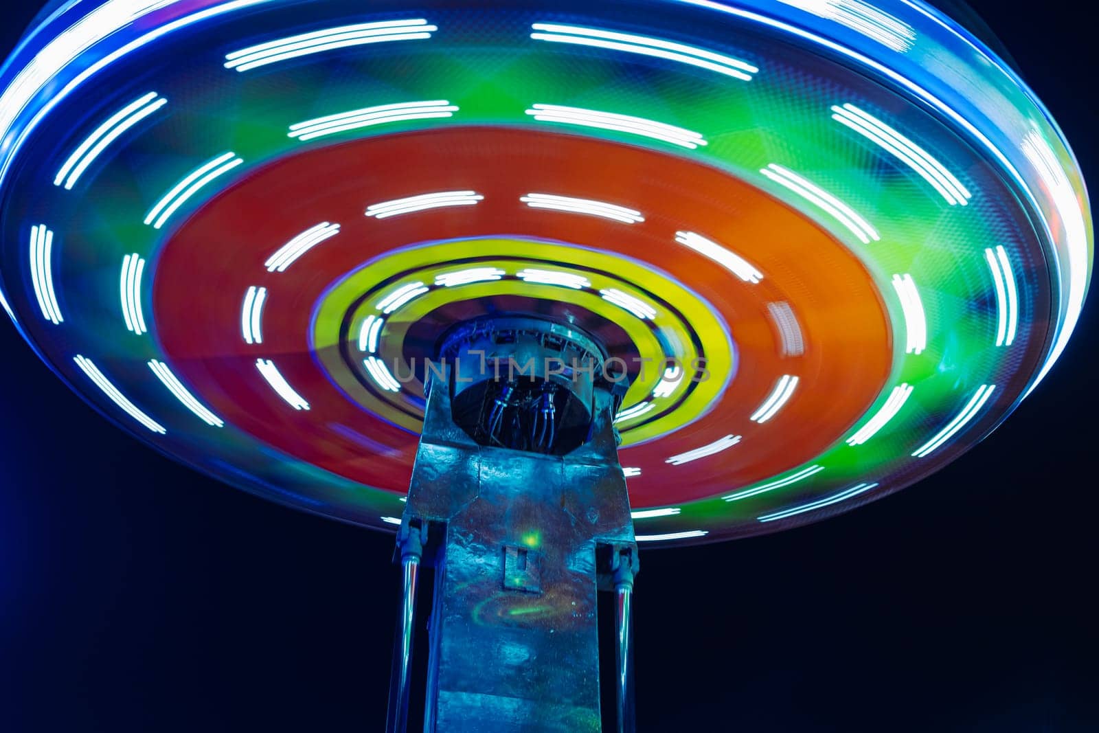 attraction in the amusement park in the evening, close-up. High quality photo