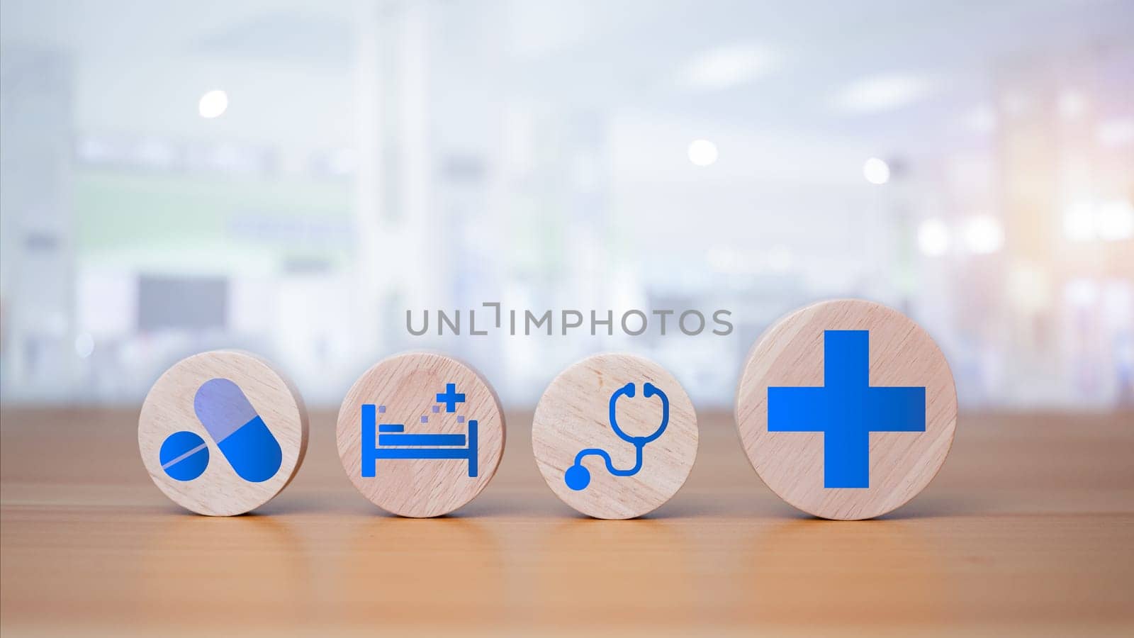 Wooden blocks with medical symbols on wooden background representing health concept with treatment and medicine. by Unimages2527