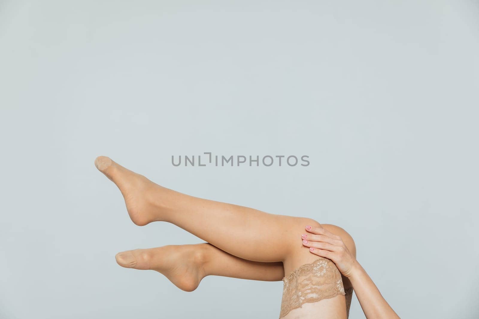 a women's feet in body stockings women's hands woman