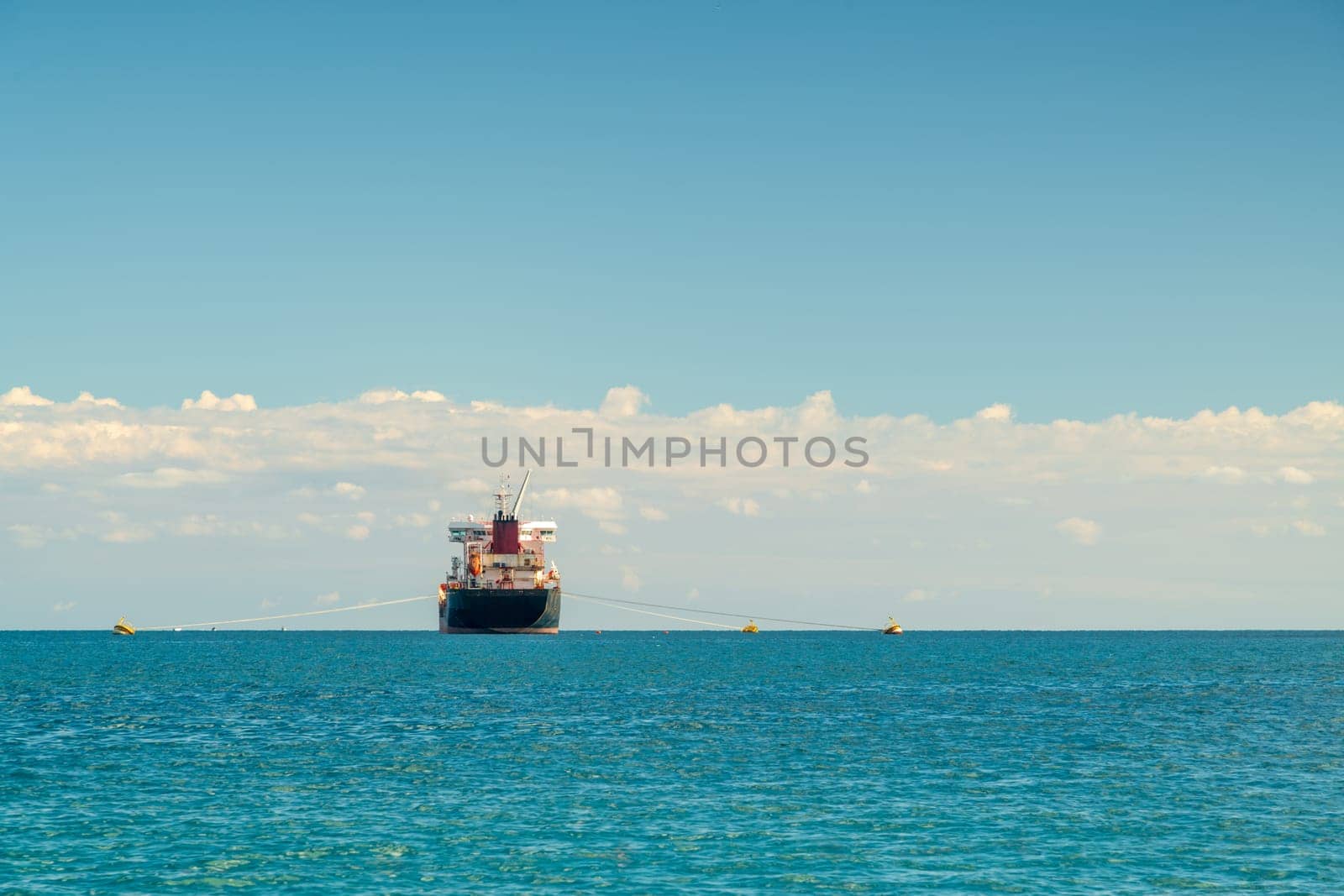 Oil chemical tanker anchored in the Mediterranean sea on a clear sunny day