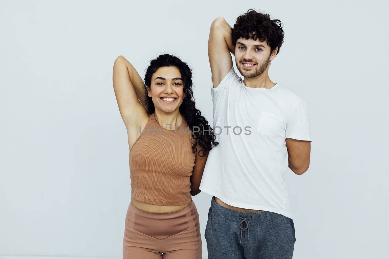 a man and woman yoga show hand stretching exercises