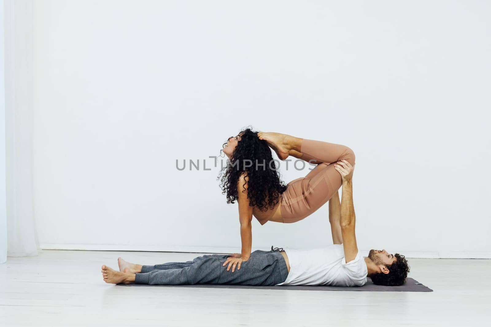 duo for yoga performance stretching spirituality training by Simakov