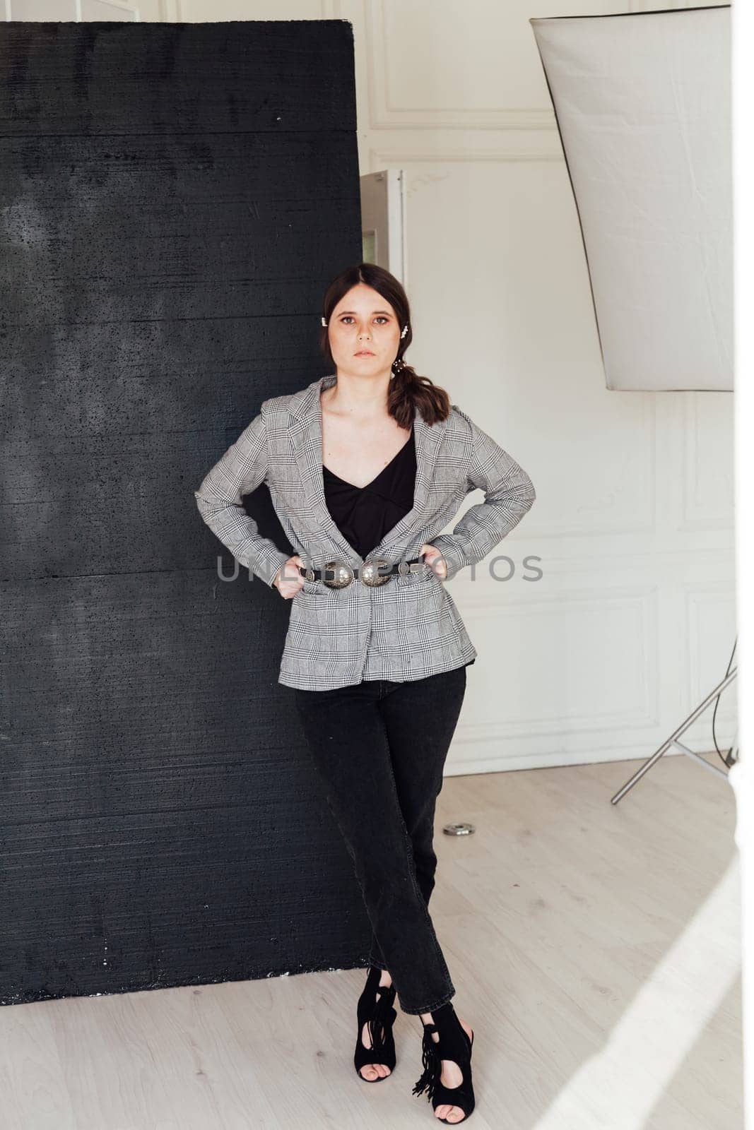 fashionable business woman in jacket on a black and white background