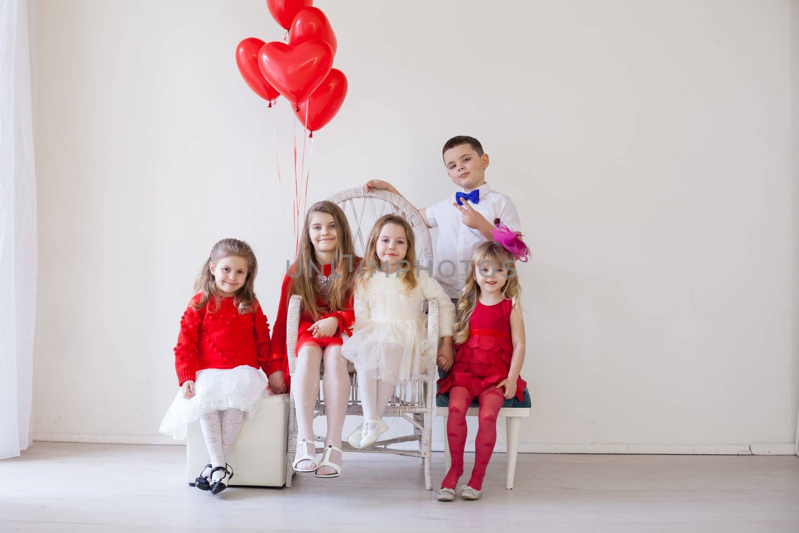 beautiful kids with balloons on Valentine's Day by Simakov