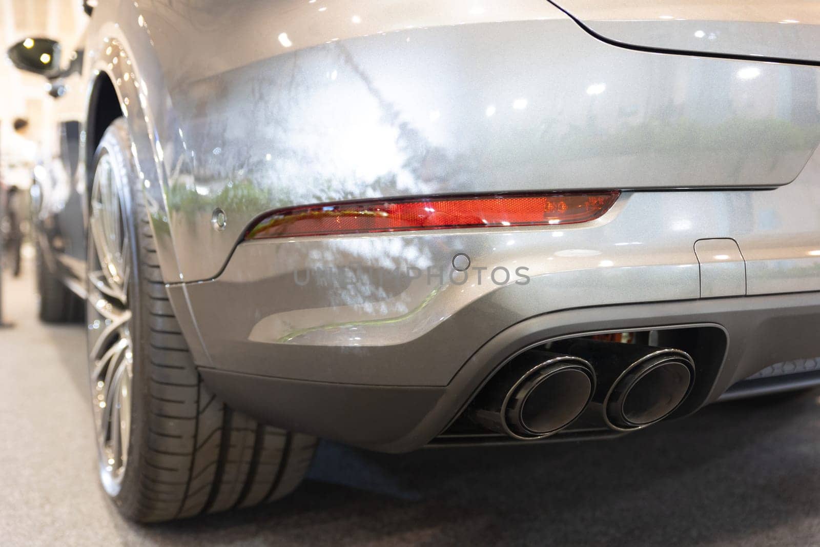 The rear end of a silver sports car