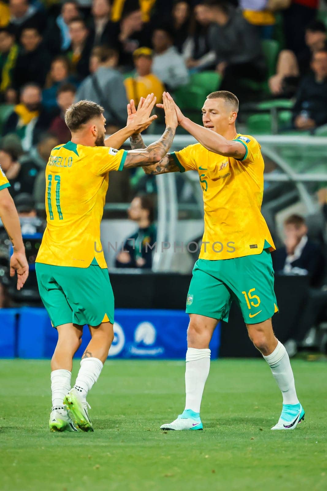 MELBOURNE, AUSTRALIA - NOVEMBER 16: Mitchell Duke of Australia celebrates scoring with teammates during the 2026 FIFA World Cup Qualifier match between Australia Socceroos and Bangladesh at AAMI Park on November 16, 2023 in Melbourne, Australia
