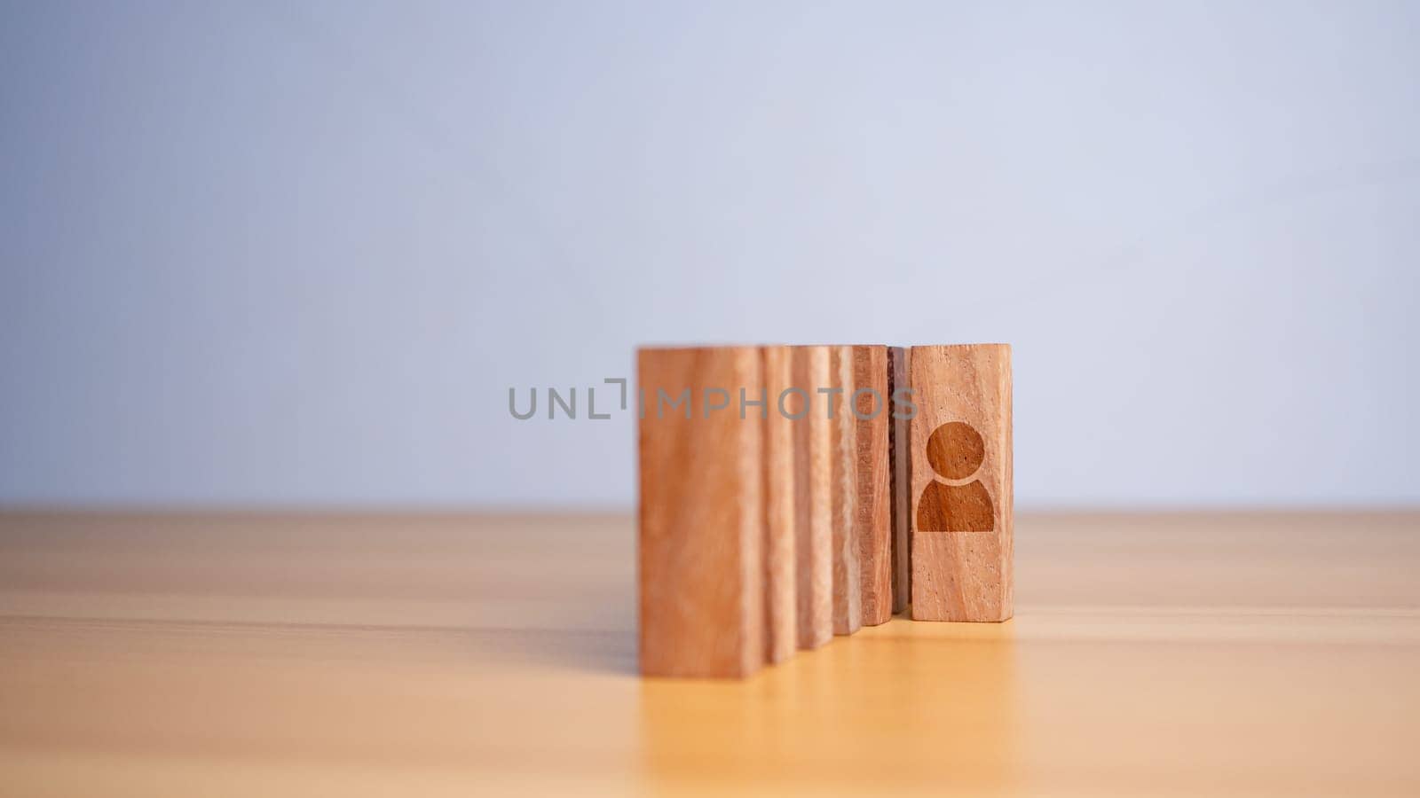 Concept of Business and HR for leadership and team leader. One cube wood out in front  Different and stand out from the group by Unimages2527