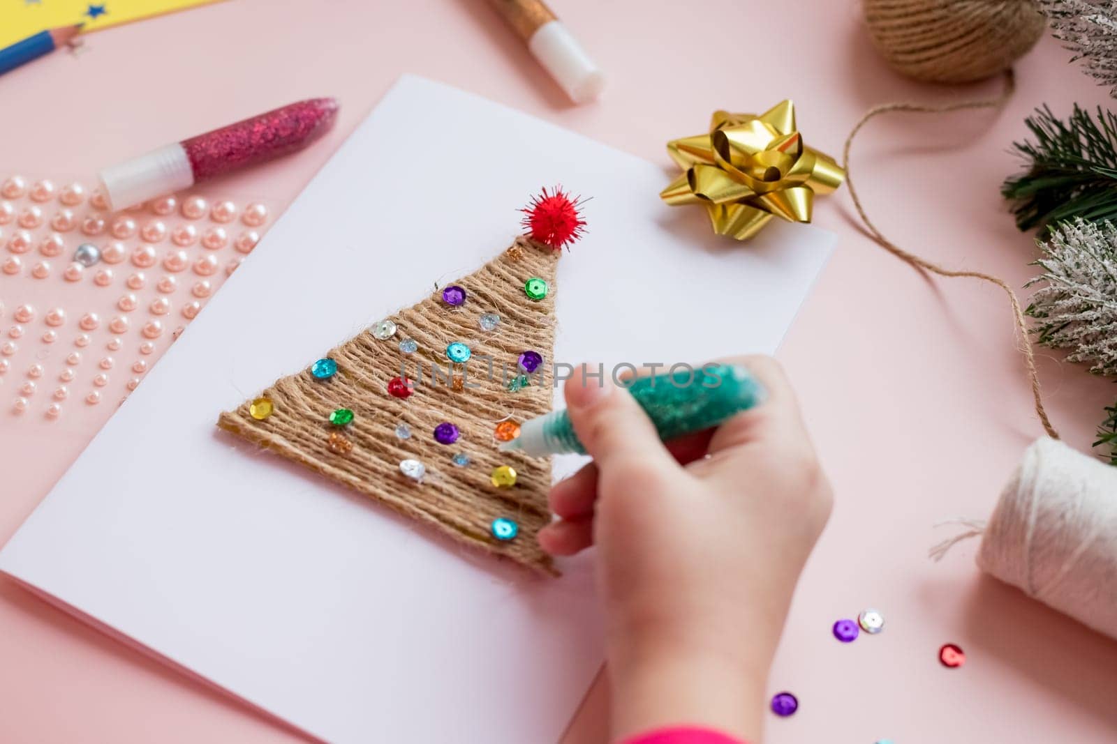 Making handmade christmas tree your own hands. Children's DIY concept. Making xmas toys decoration or greeting card.