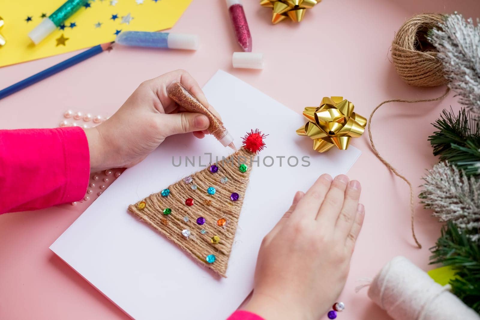 Making handmade christmas tree your own hands. Children's DIY concept. Making xmas toys decoration or greeting card.