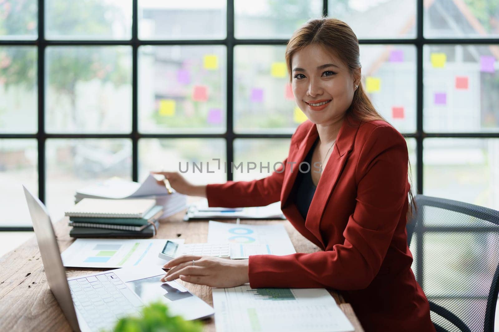 planning, auditing, business planning, finance, young asian business woman working on computer and checking investment documents and planning marketing to increase profit, business concepts. by Manastrong