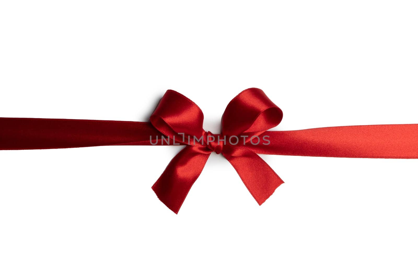 Red gift bow on white by Yellowj