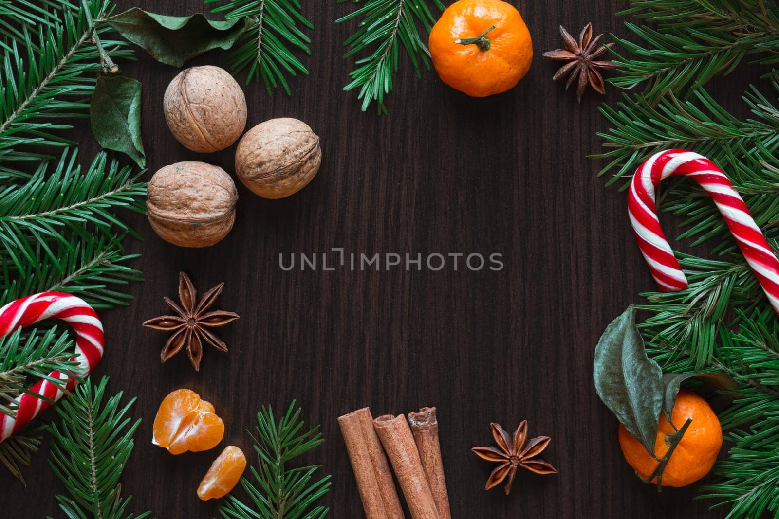 Christmas card. Tangerines, nuts, spruce, candy, star