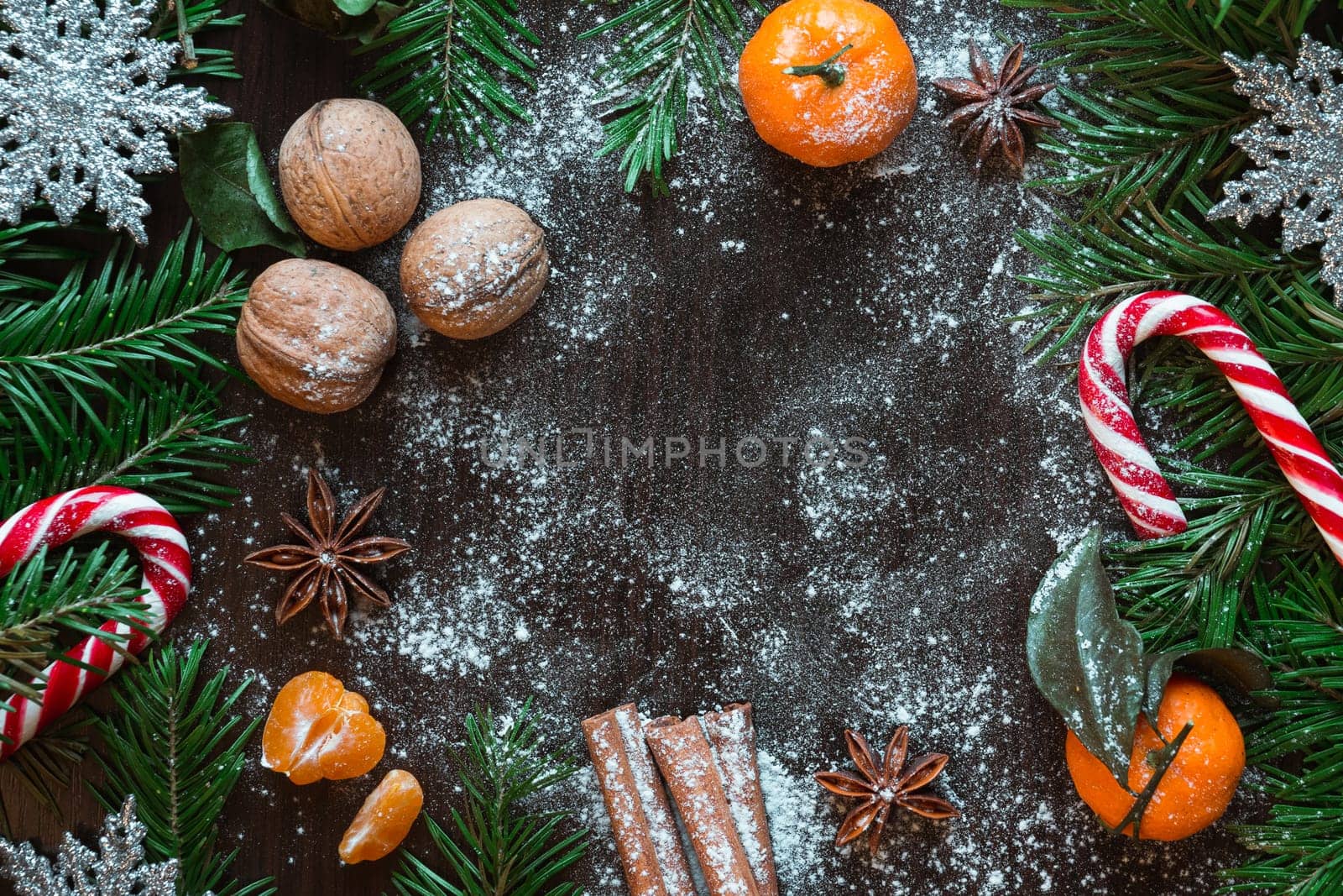 Christmas card. Tangerines, nuts, spruce, candy, star