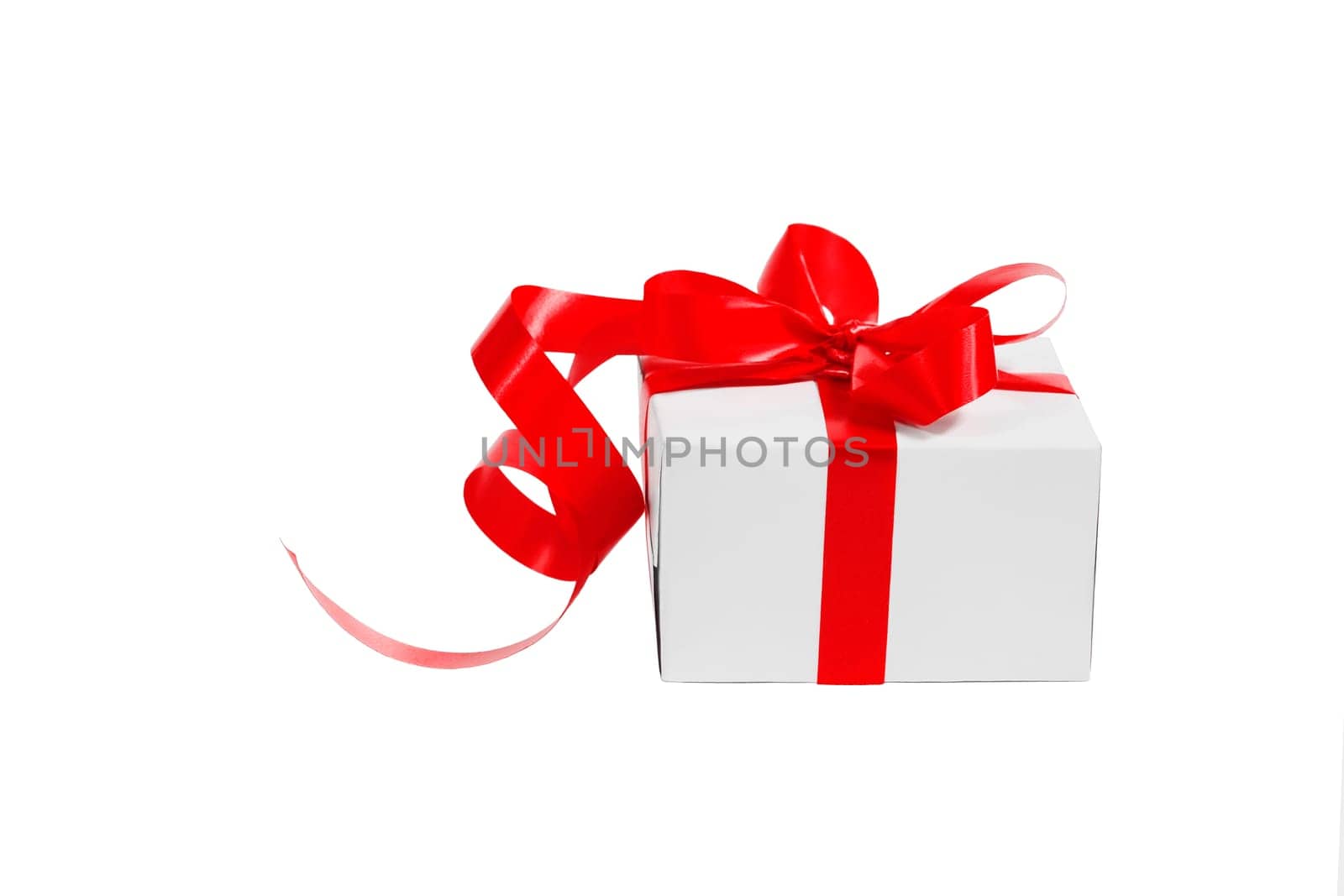 White gift box with red bow isolated