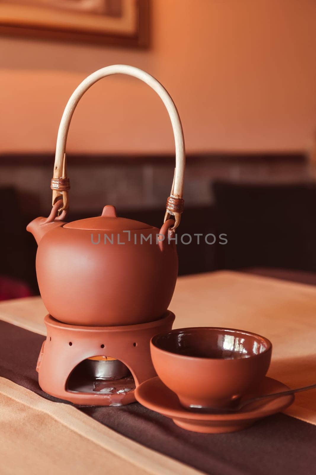 A tea set made of a teapot and a cup made of clay. Tea ceremony