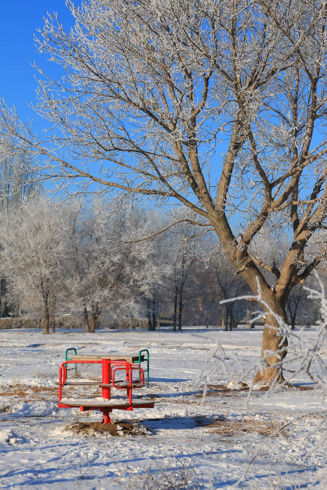 Children`s playground in winter without children by ElenaNEL