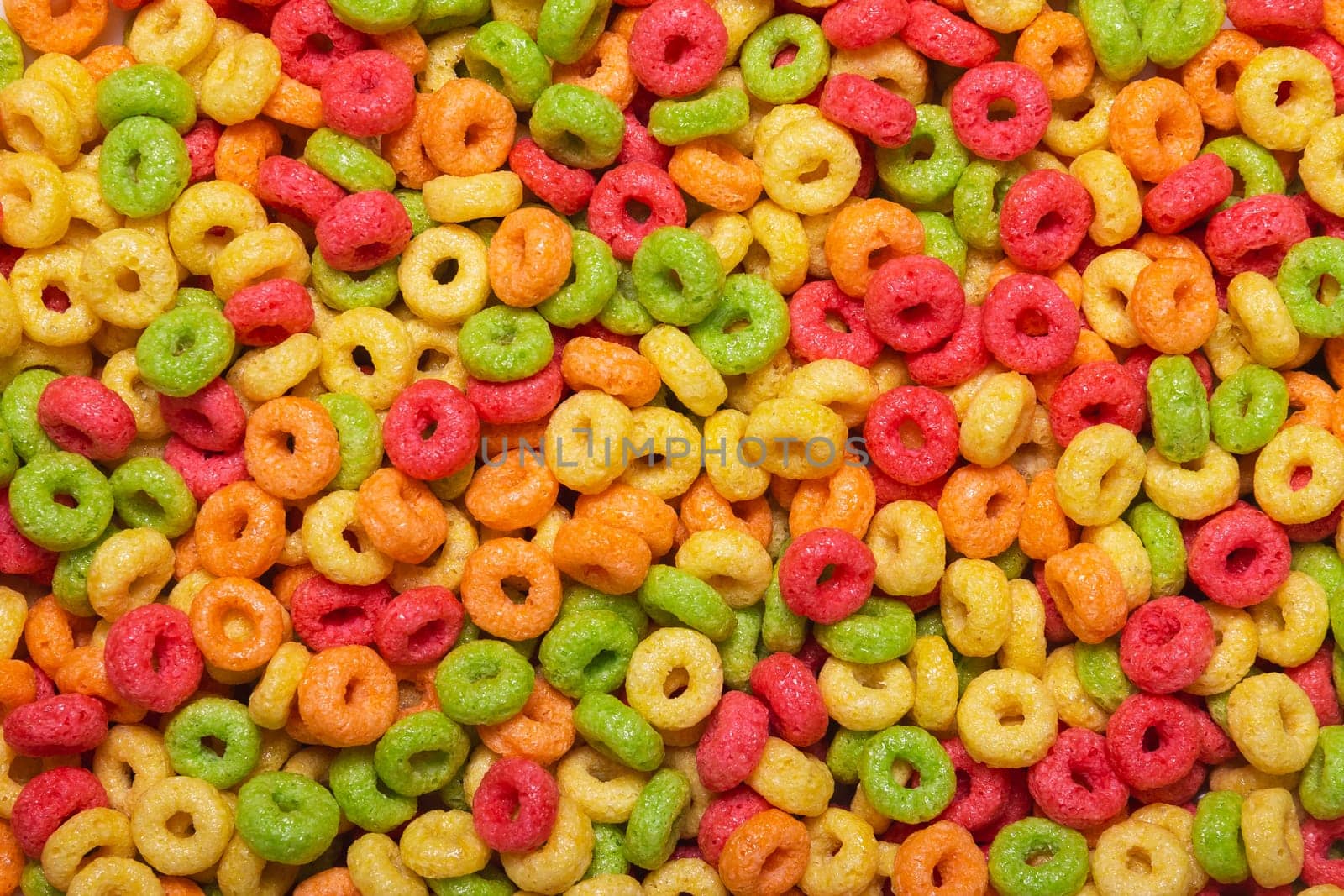 Colored sweet corn rings for the whole frame close-up. A quick, fun and healthy breakfast for children by ElenaNEL
