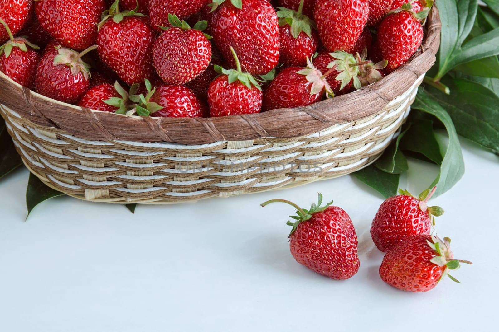 Ripe red strawberries. Berry in wicker basket