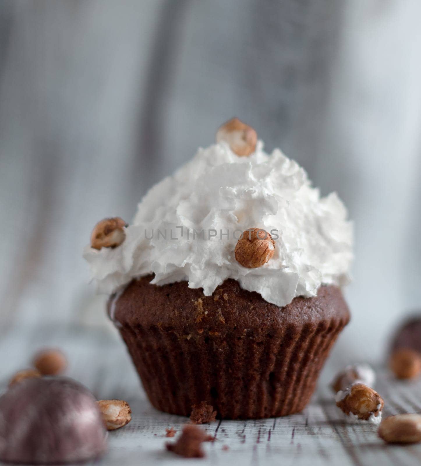 Delicious chocolate brownie muffins with nuts and whipped cream