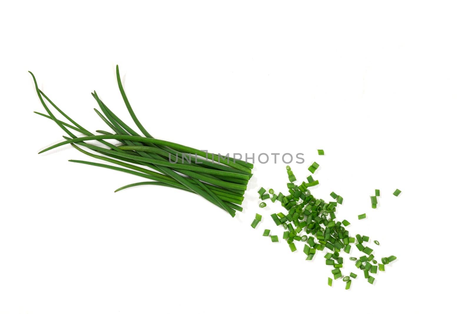 Young green onions partially chopped. Green onions contain vitamins that are good for your health. Sliced onions can be added to soup, salad, and other dishes