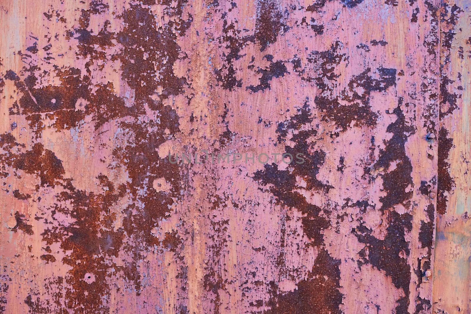 Photo abstract background peeling paint on metal. Cracks. Rust. Old fence.