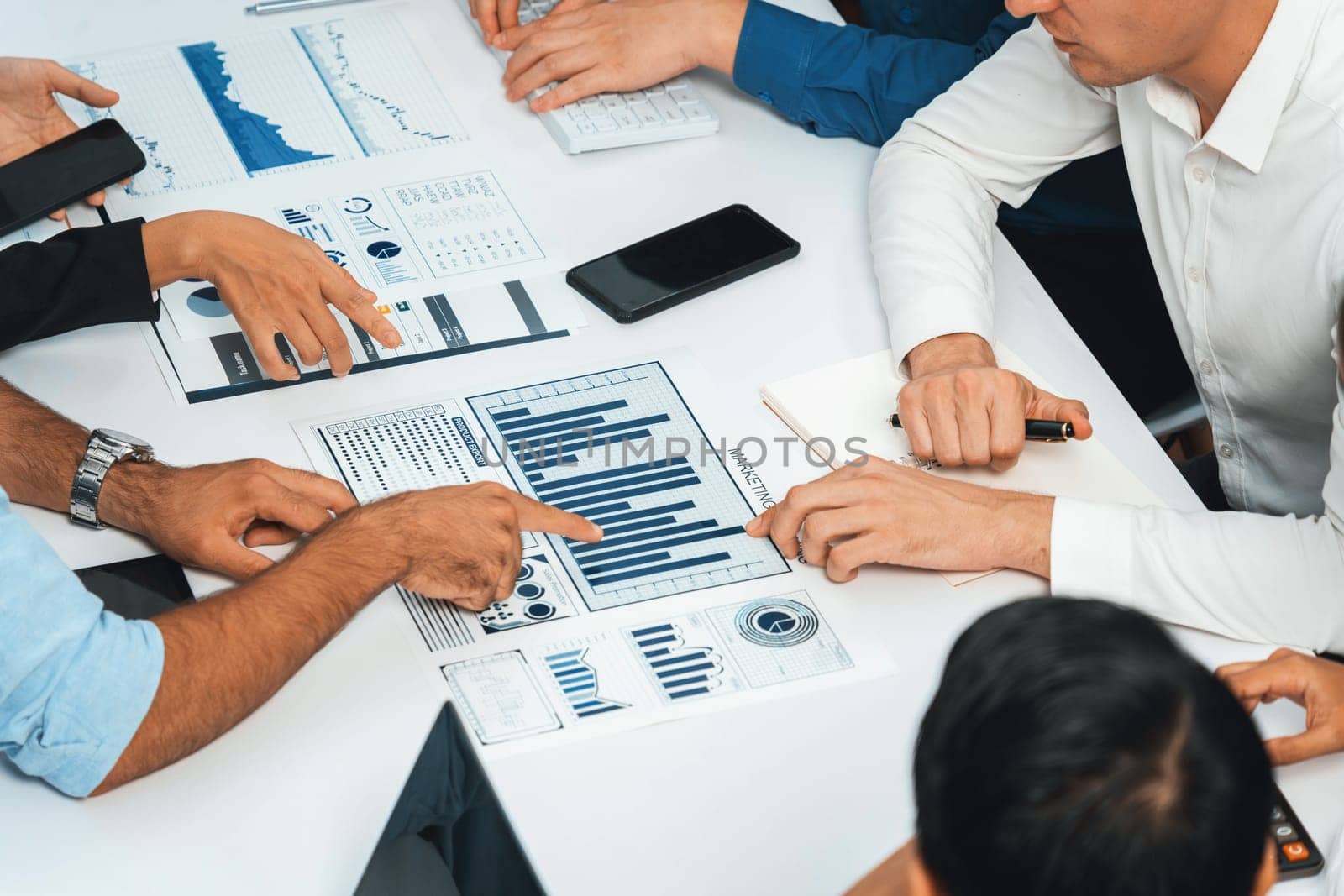 Analyst team utilizing BI Fintech to analyze financial data at table. Prudent by biancoblue