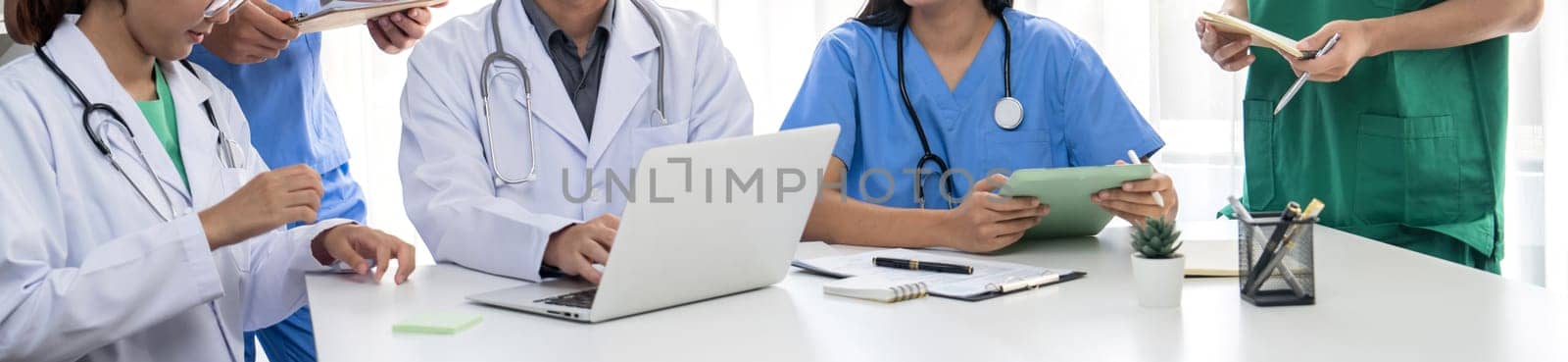 Professional various team of medical working together on the desk. Rigid by biancoblue