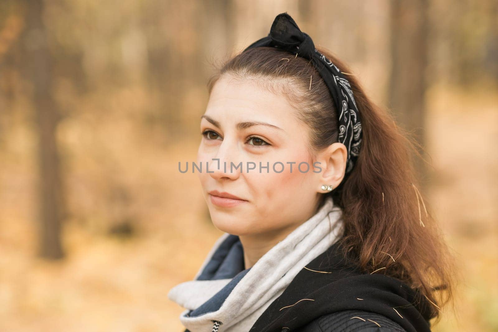 Outdoor atmospheric lifestyle portrait of young beautiful young woman copy space. Warm autumn fall season. Millennial generation and youth by Satura86
