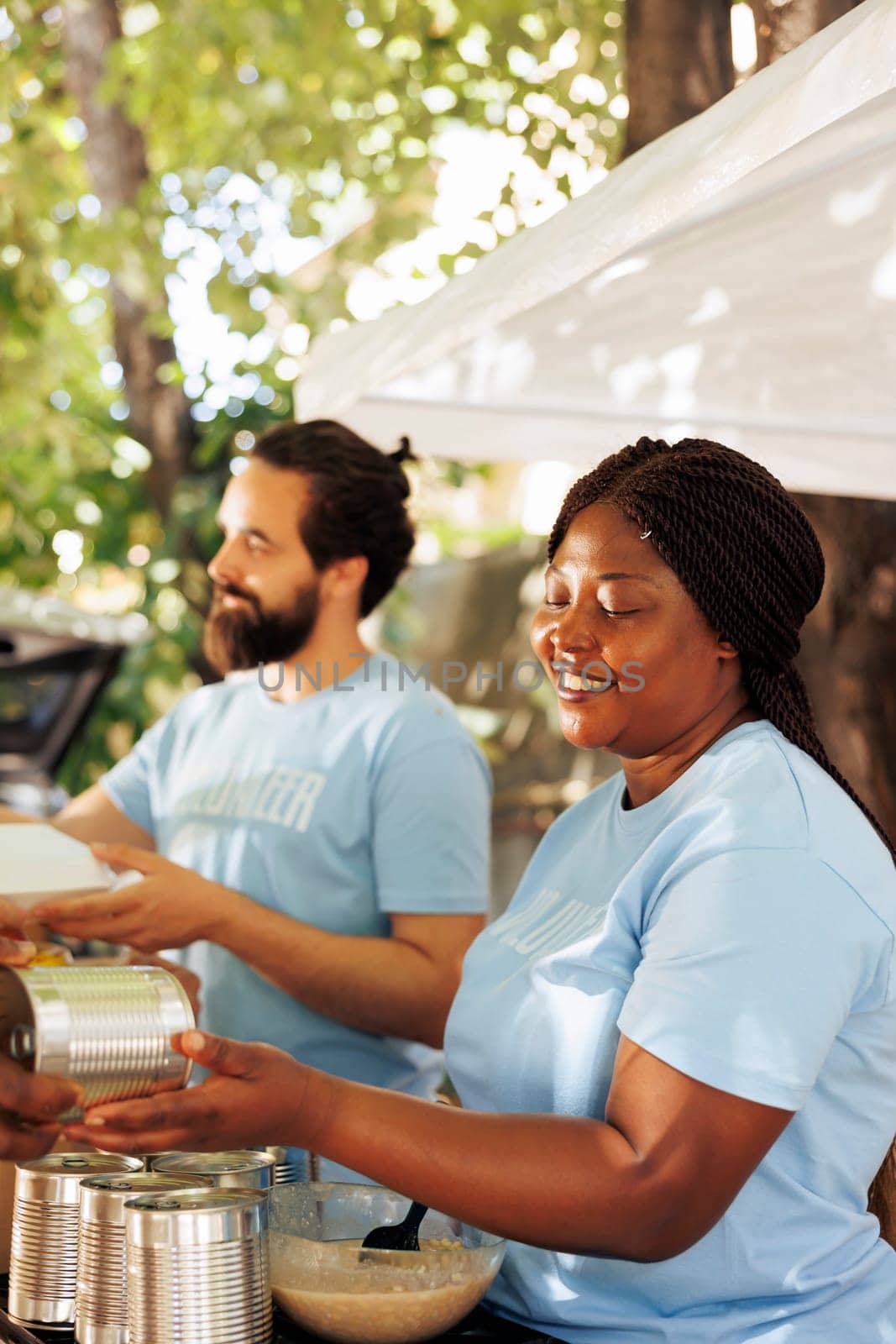 Food drive: Volunteers helping the needy by DCStudio