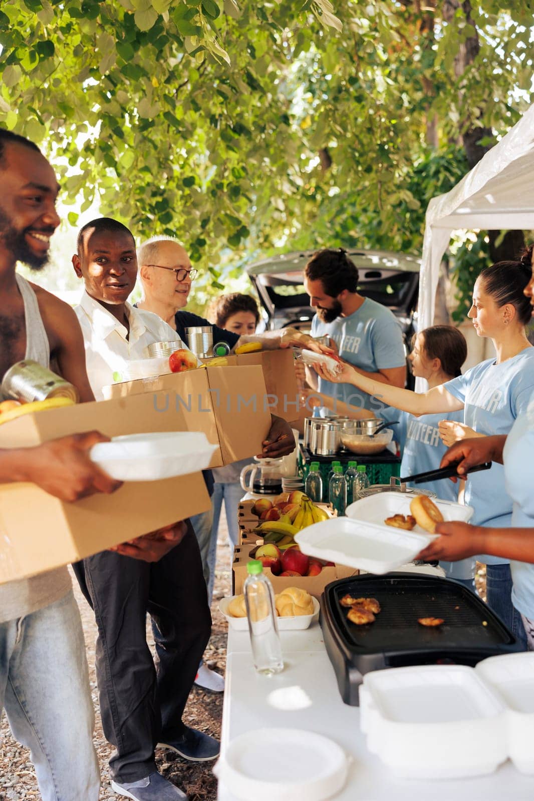 Helping needy: Food distribution outdoor by DCStudio