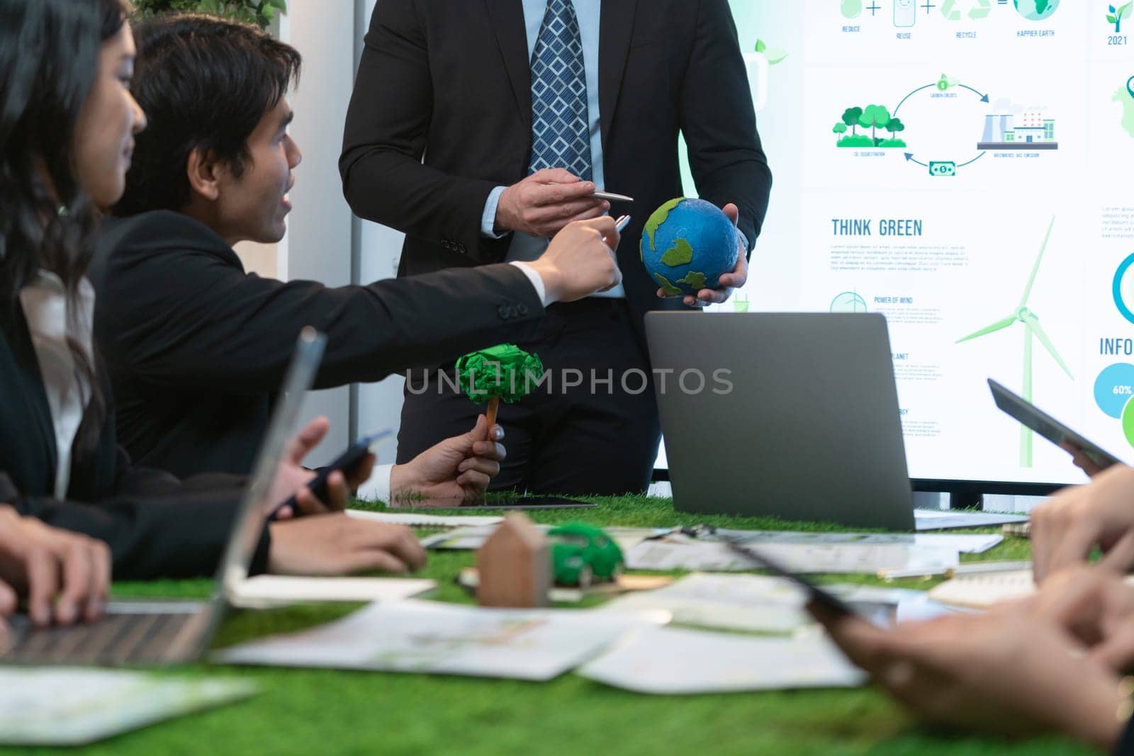 Businessman leader give presentation on eco-friendly implementation. Quaint by biancoblue