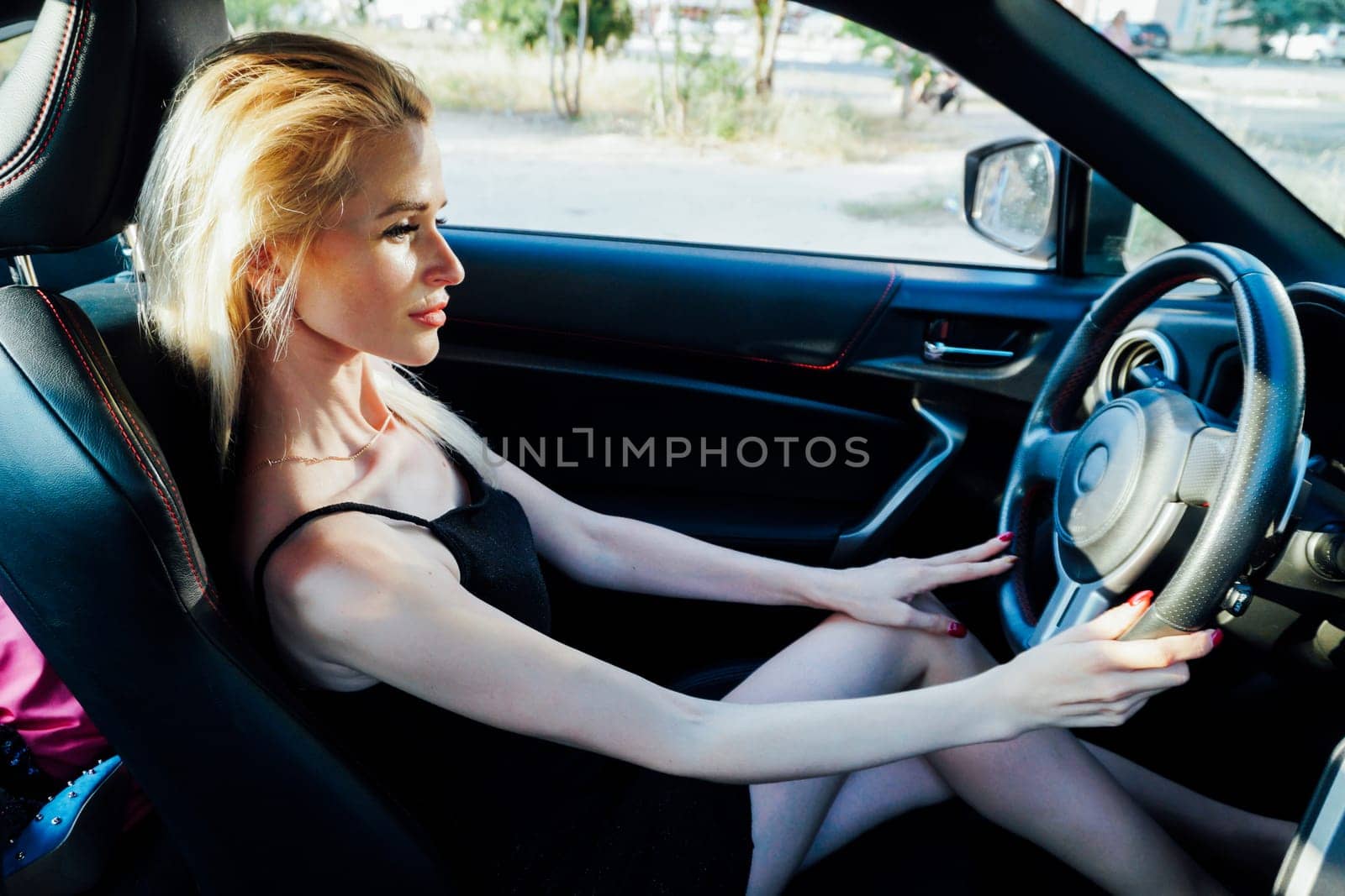 a woman driver behind the wheel of a car journey driving