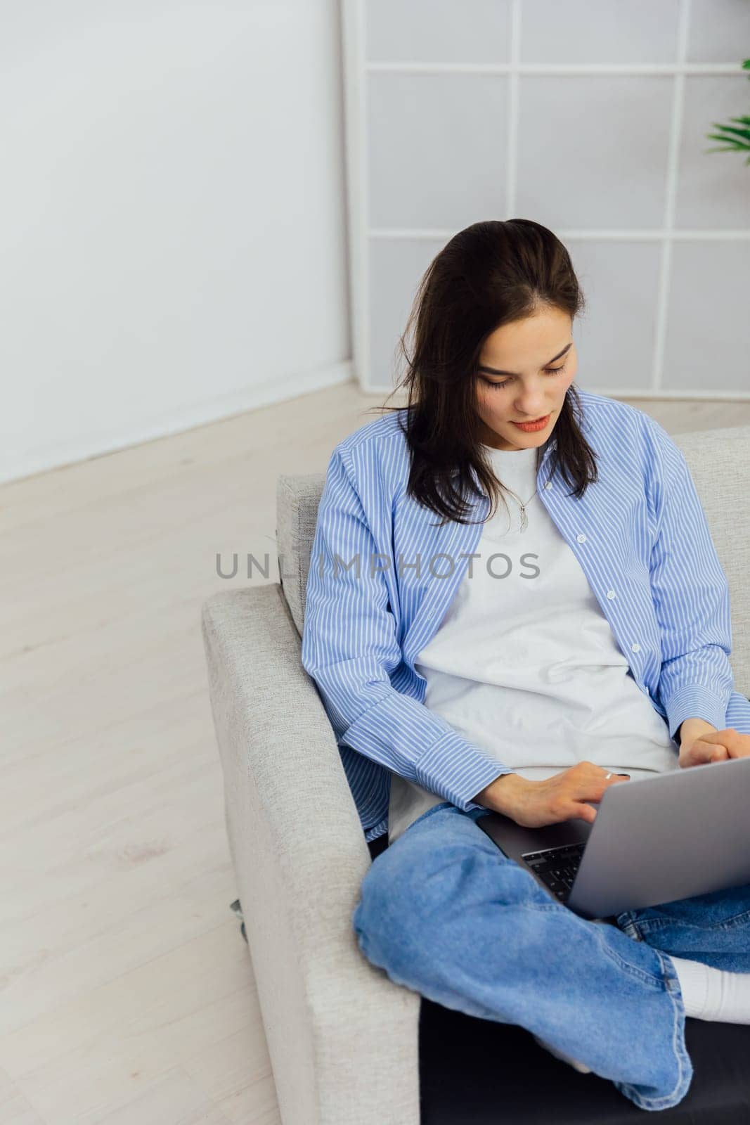 woman in room with computer technology online communication learning internet