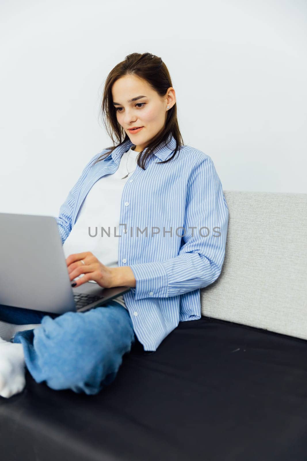 woman in a room with computer technology online communication learning internet by Simakov