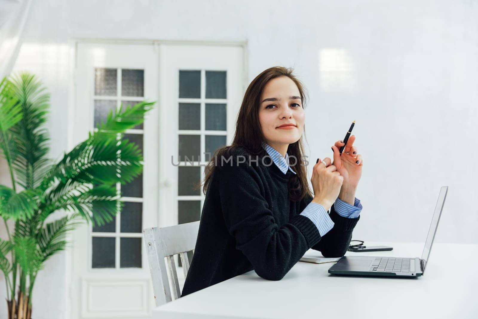 woman at the computer in the office at remote work Internet communication IT work communication online learning