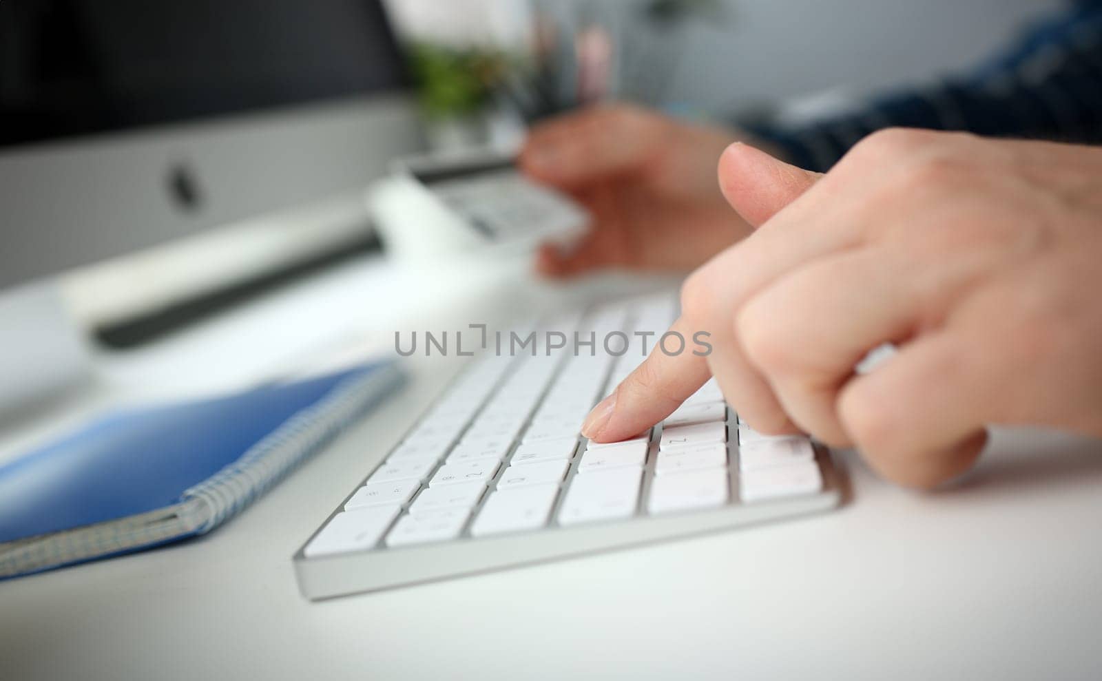 Female arms hold credit card press buttons making transfer closeup. Anti-fraud financial security when entering client discount program number or filling personal credential password login to account