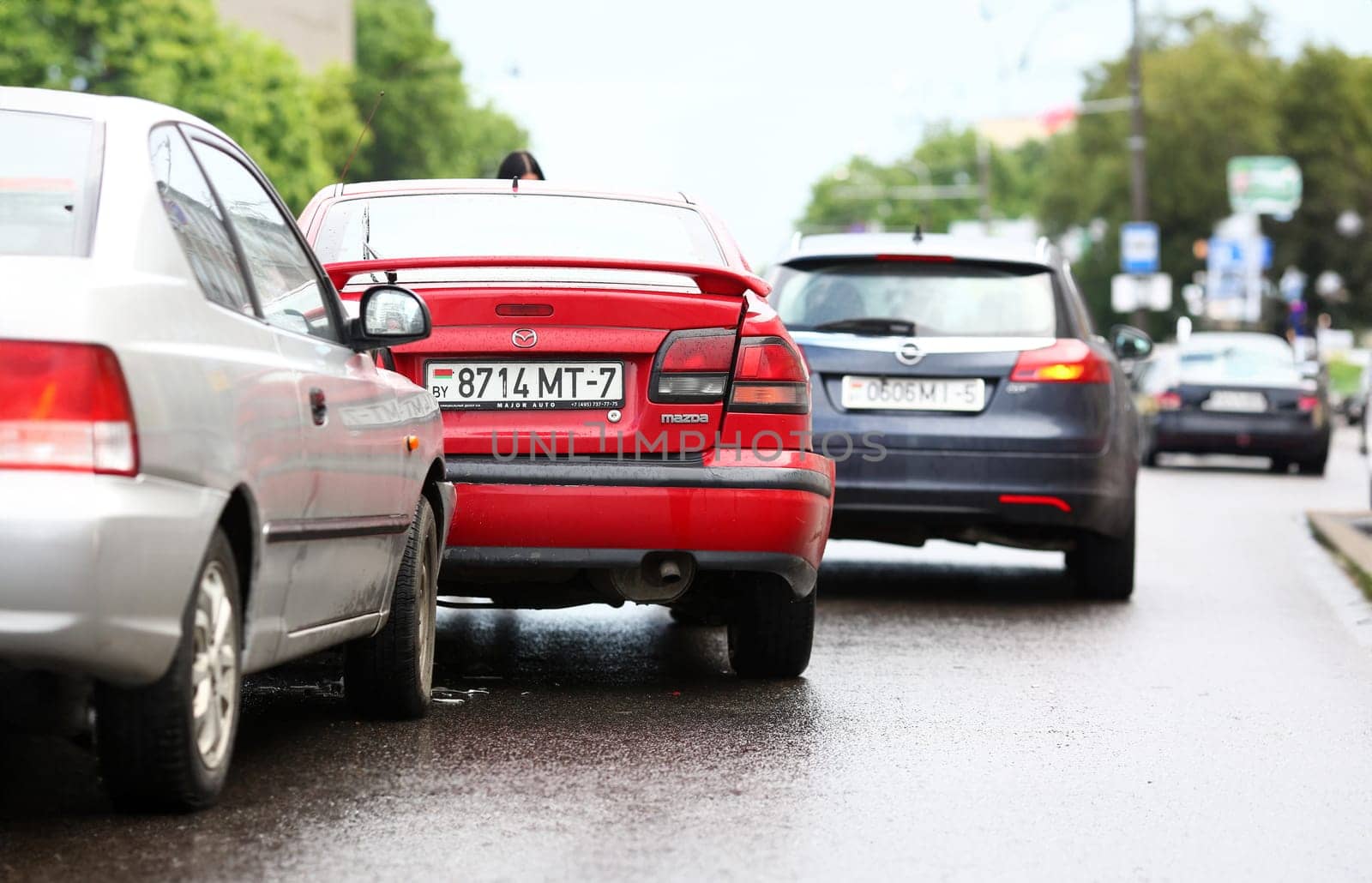 Minsk, Belarus - May 24, 2018 :Accident of red and silver car after rain damage. Illustrative editorial