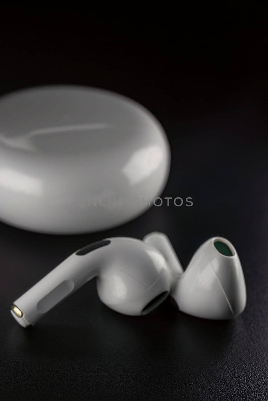 ROSTOV-ON-DON, RUSSIA - APRIL 28, 2018: Apple AirPods wireless Bluetooth headphones and charging case for Apple iPhone. New Apple Earpods Airpods in box. by zokov