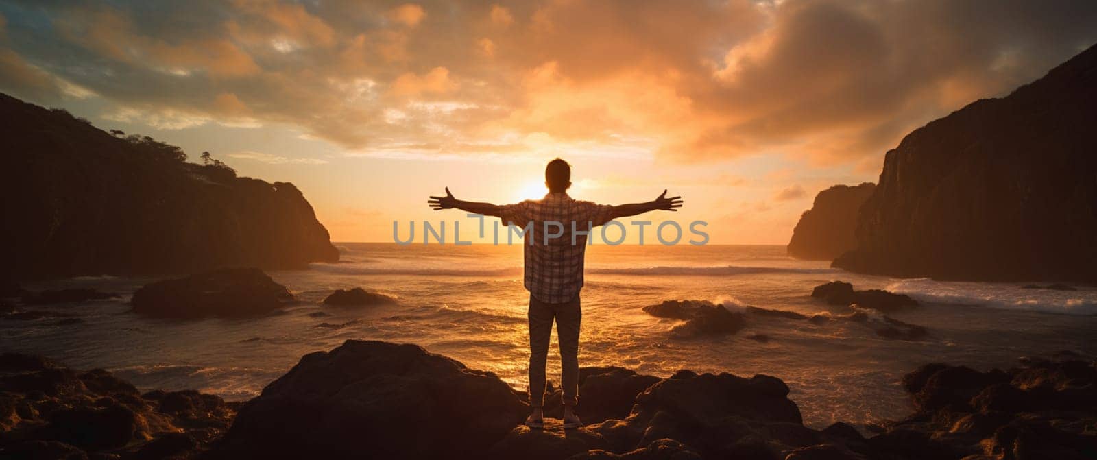 Happy young man in beautiful nature sunset with arms outstretch feeling free as a bird. People freedom, letting go, and getting away from it all concept. . High quality photo