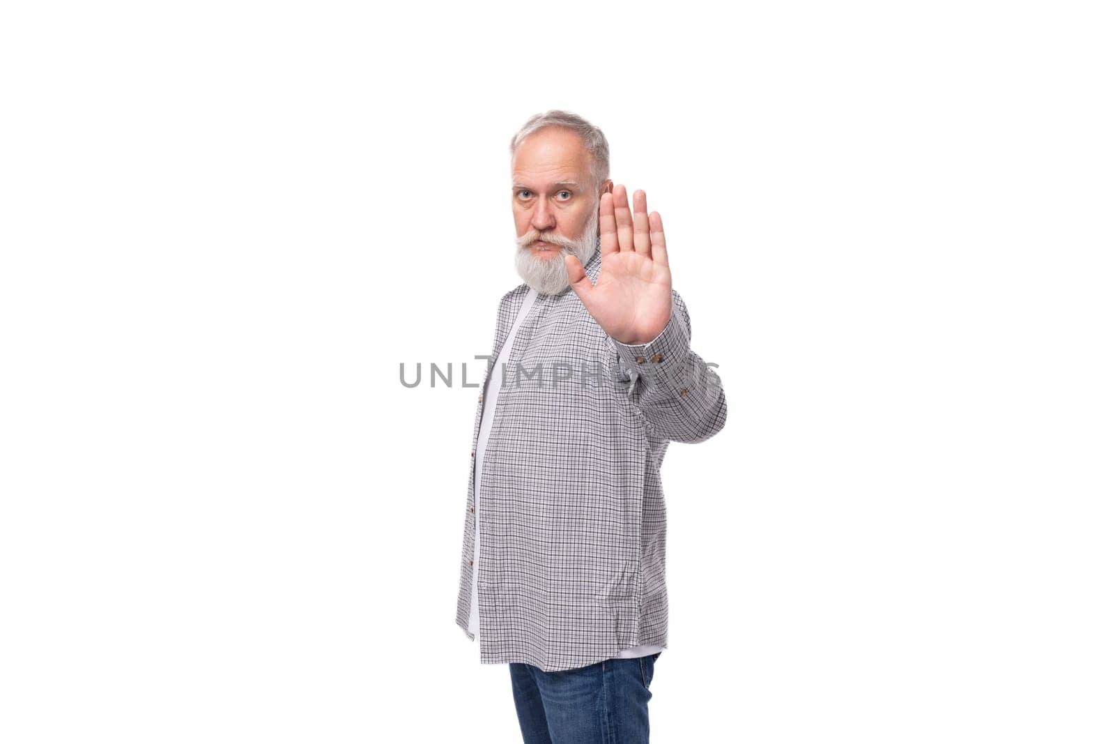 nice kind pensioner man with beard and big gray mustache shows stop gesture.