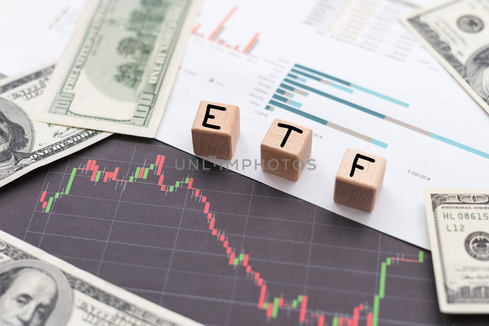 ETF financial business concept. Wooden cubes and paper dollar bills as a background by Andelov13