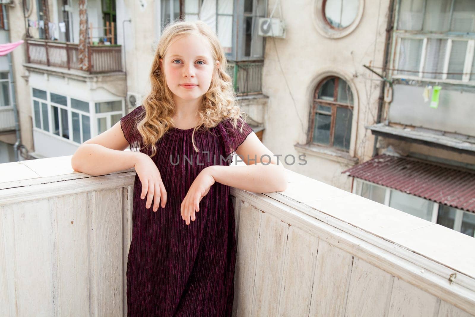 girl standing on the balcony in the room