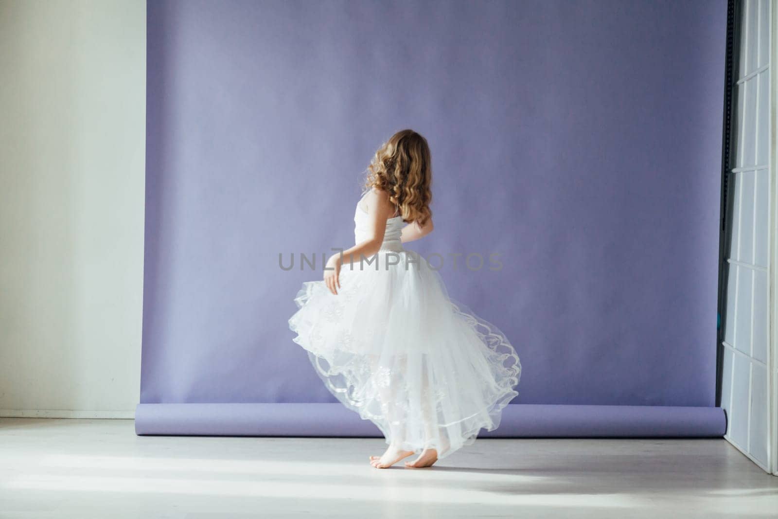 girl dancing in the studio in beautiful dance dress