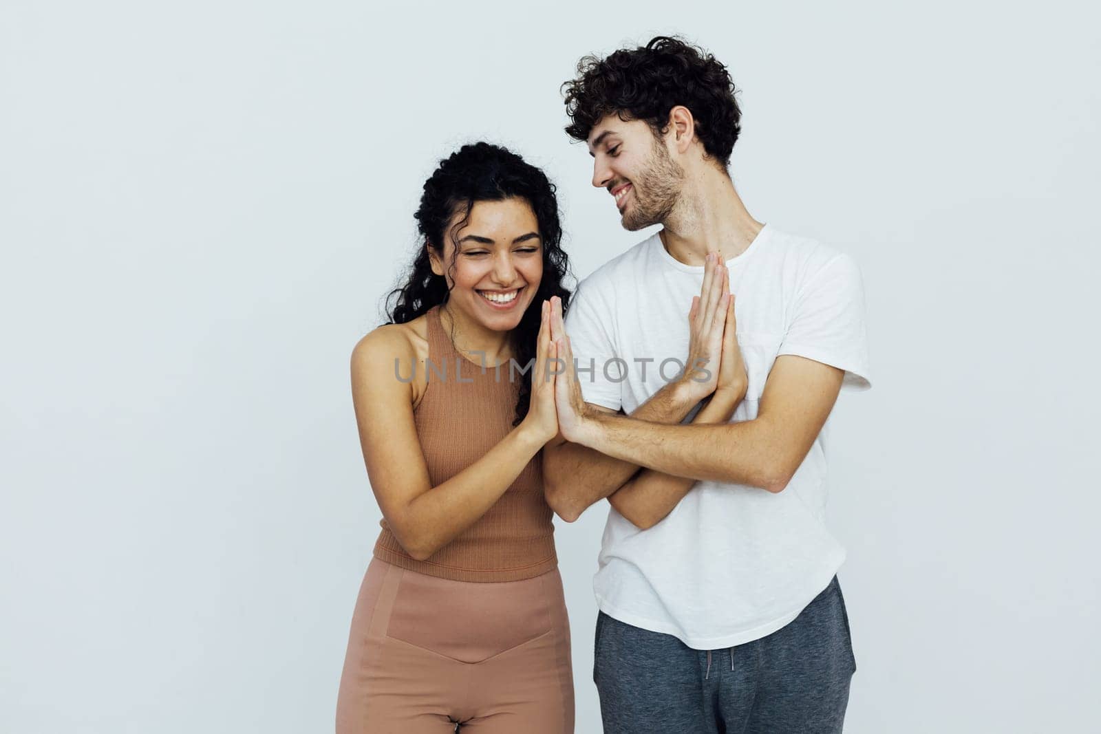 stretching exercises flexible body acrobatic poses yoga woman and man do gymnastics warm-up by Simakov