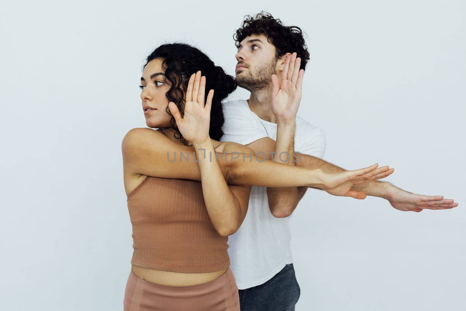 a flexible body acrobatics yoga poses woman and man do gymnastics warm-up exercises stretching