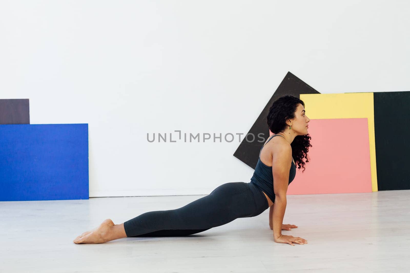 an exercises woman doing yoga relaxation classes stretching postures