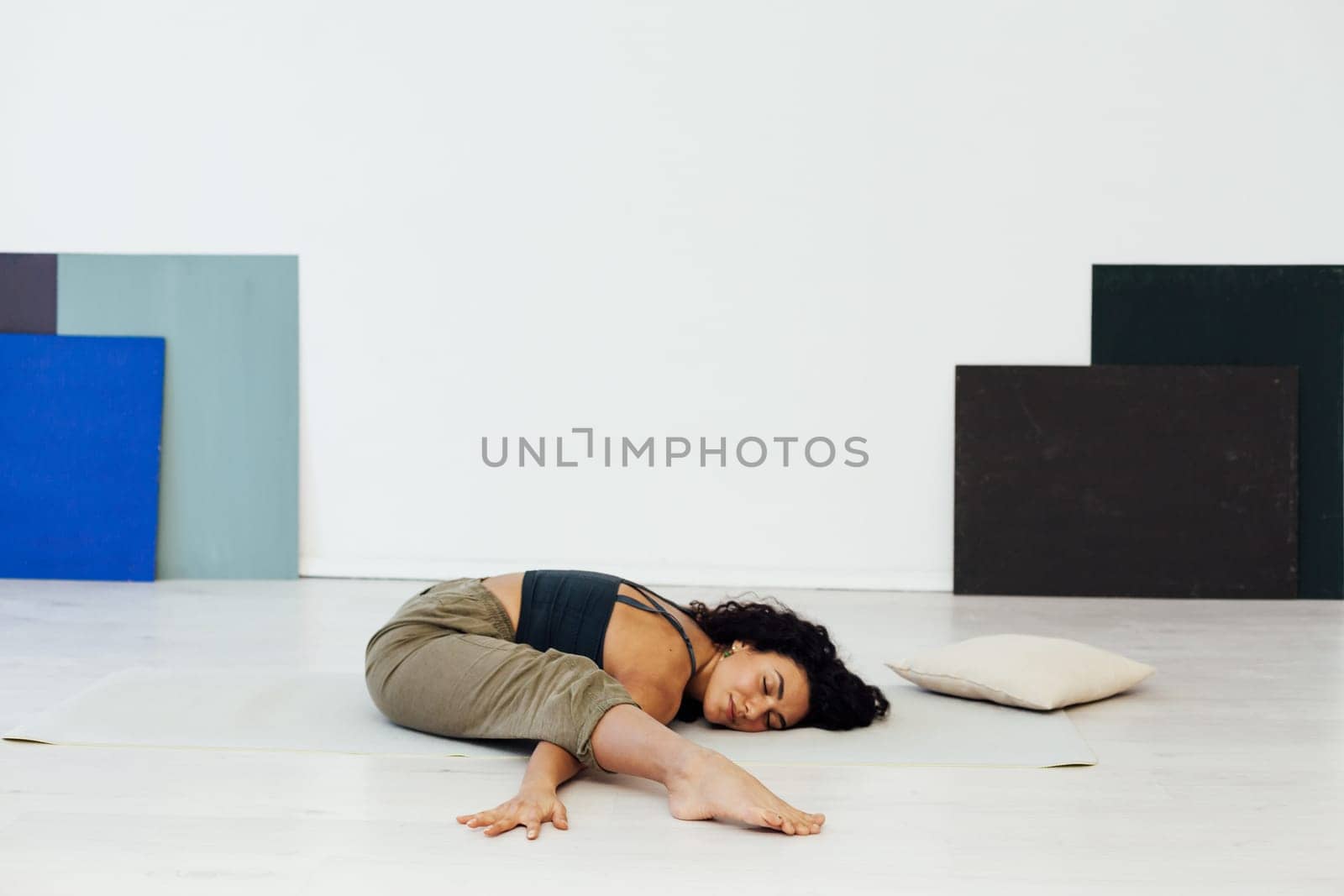 exercises relaxation classes stretching woman doing yoga lotus pose by Simakov